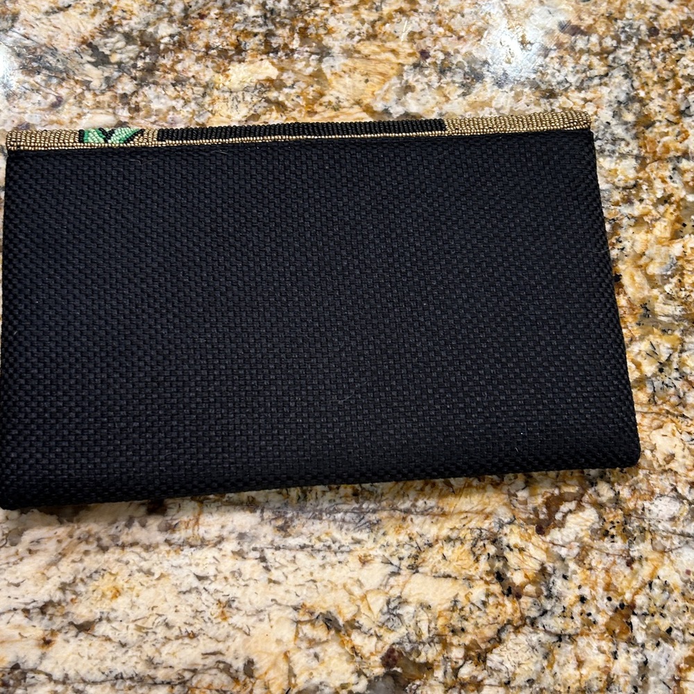 Beaded Black Clutch with Floral Design
David Jeffrey design - Picture 2 of 4